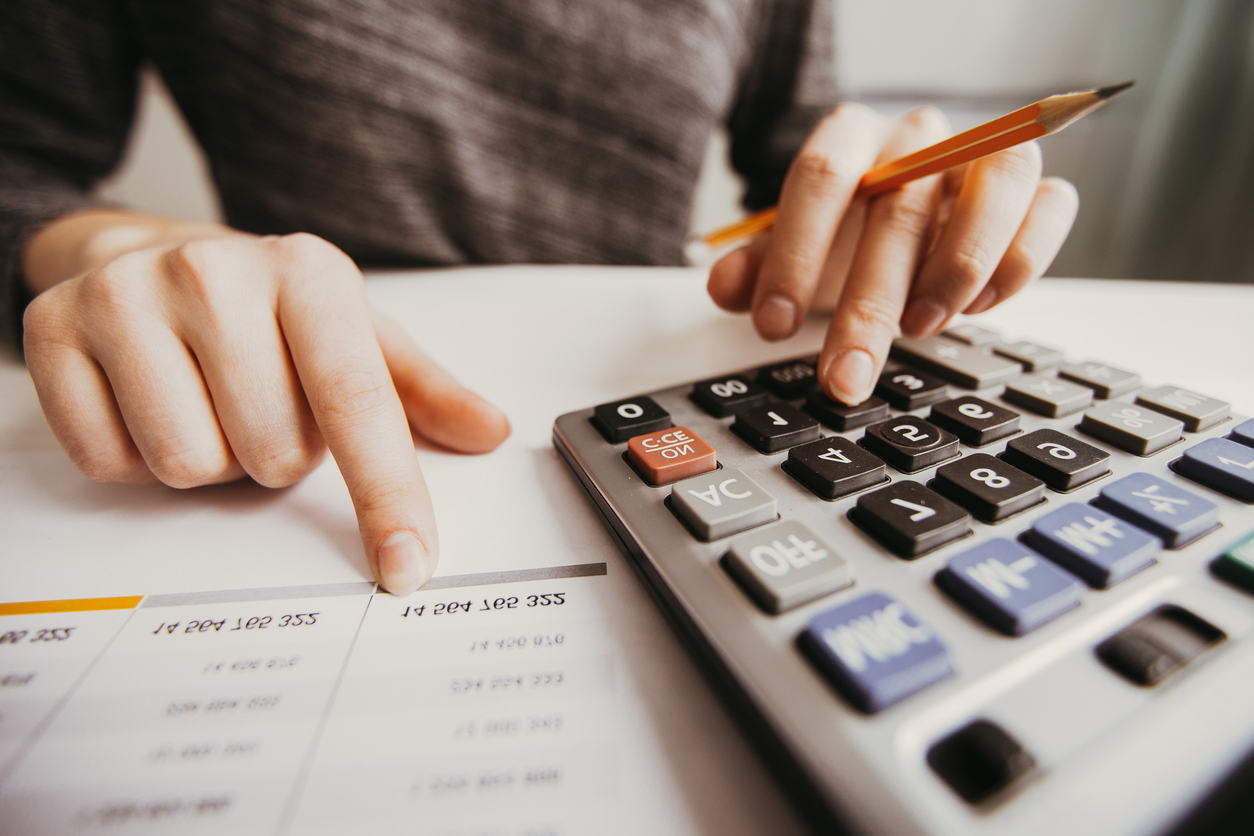 Accounting _ Closeup of Accountant Hands Counting on Calculator iStock_898962594.jpg